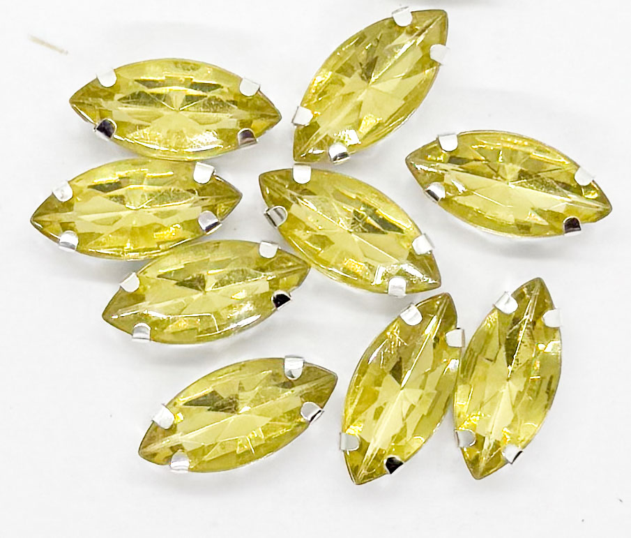 Gema engarzada navette dorado brillo 7x15mm x 10un.
