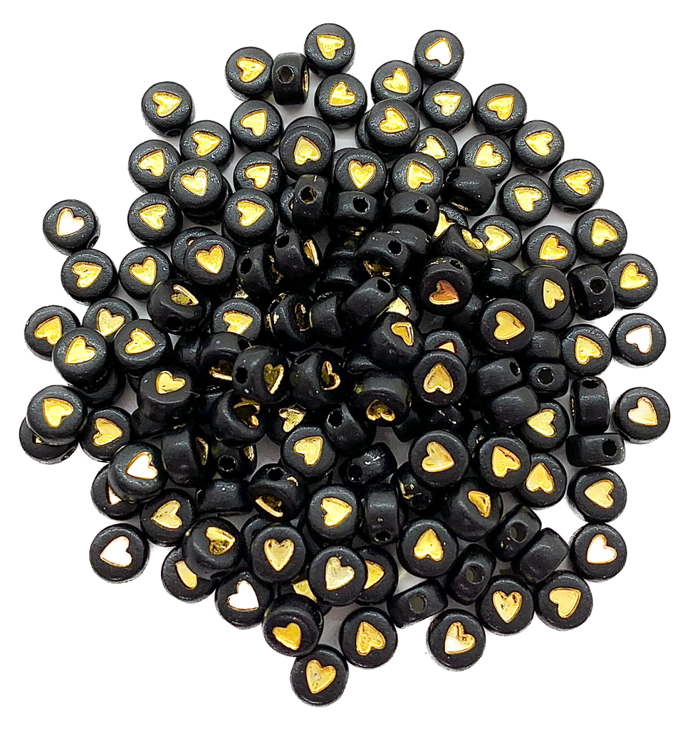 Corazón plano 7mm negro c/dorado x 10 gr. 
