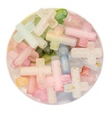 Plástico cruz traslucida pasante multicolor x 10gr 